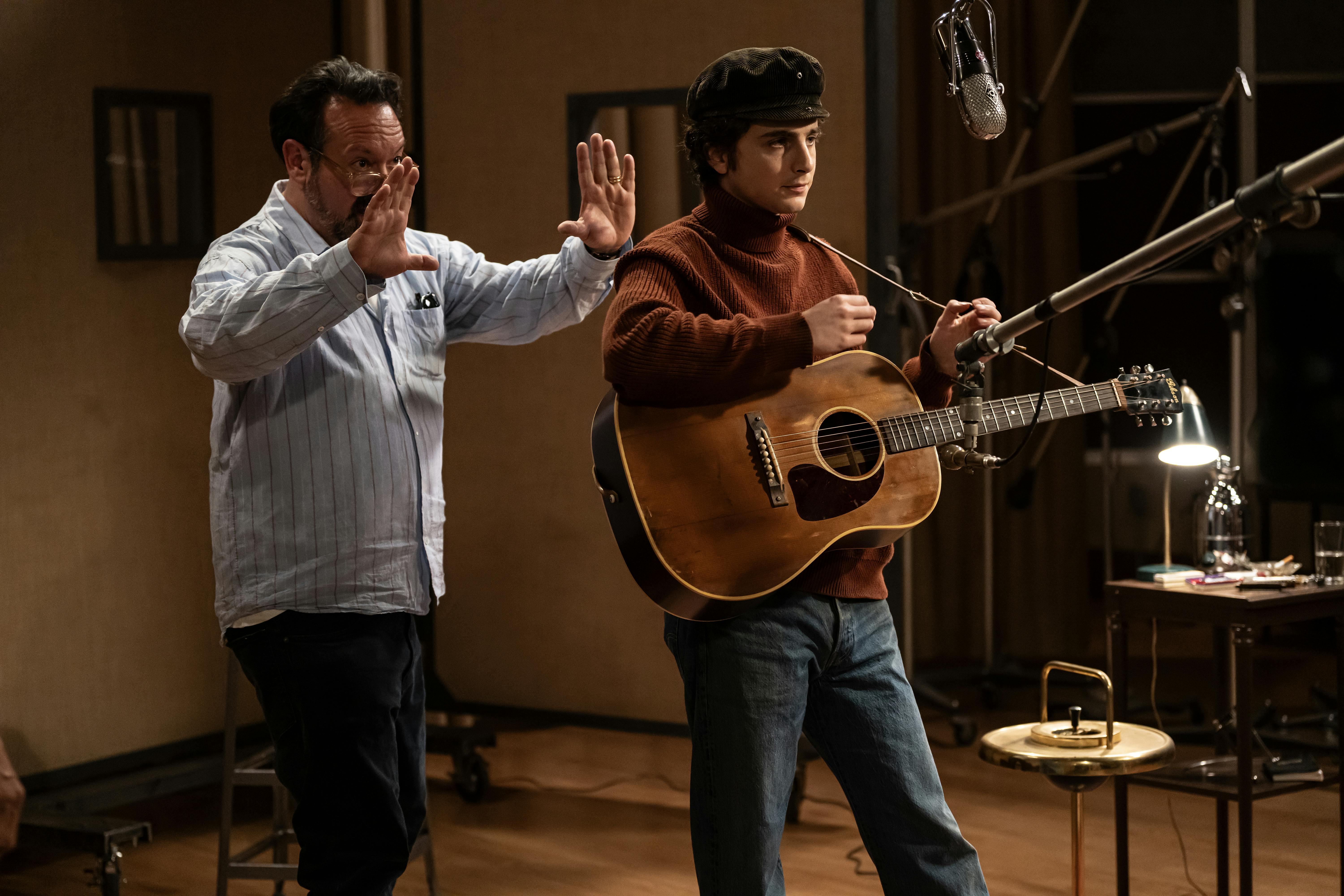 Director James Mangold and Timothée Chalamet on the set of A COMPLETE UNKNOWN. Photo by Macall Polay,  Courtesy of Searchlight Pictures. © 2024 Searchlight Pictures All Rights Reserved.