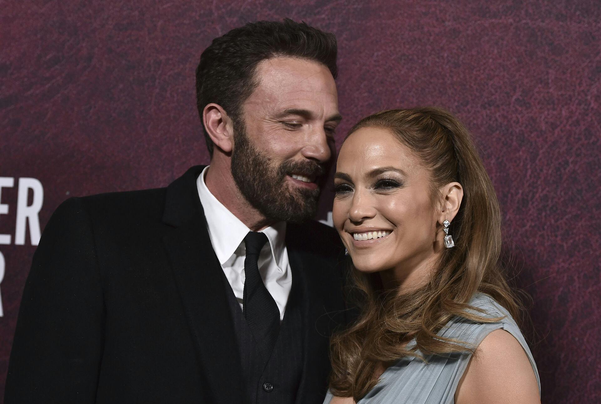 Ben Affleck, left, and Jennifer Lopez arrive at the premiere of "The Tender Bar" on Sunday, Dec. 12, 2021, at the TCL Chinese Theatre in Los Angeles. (Photo by Jordan Strauss/Invision/AP)