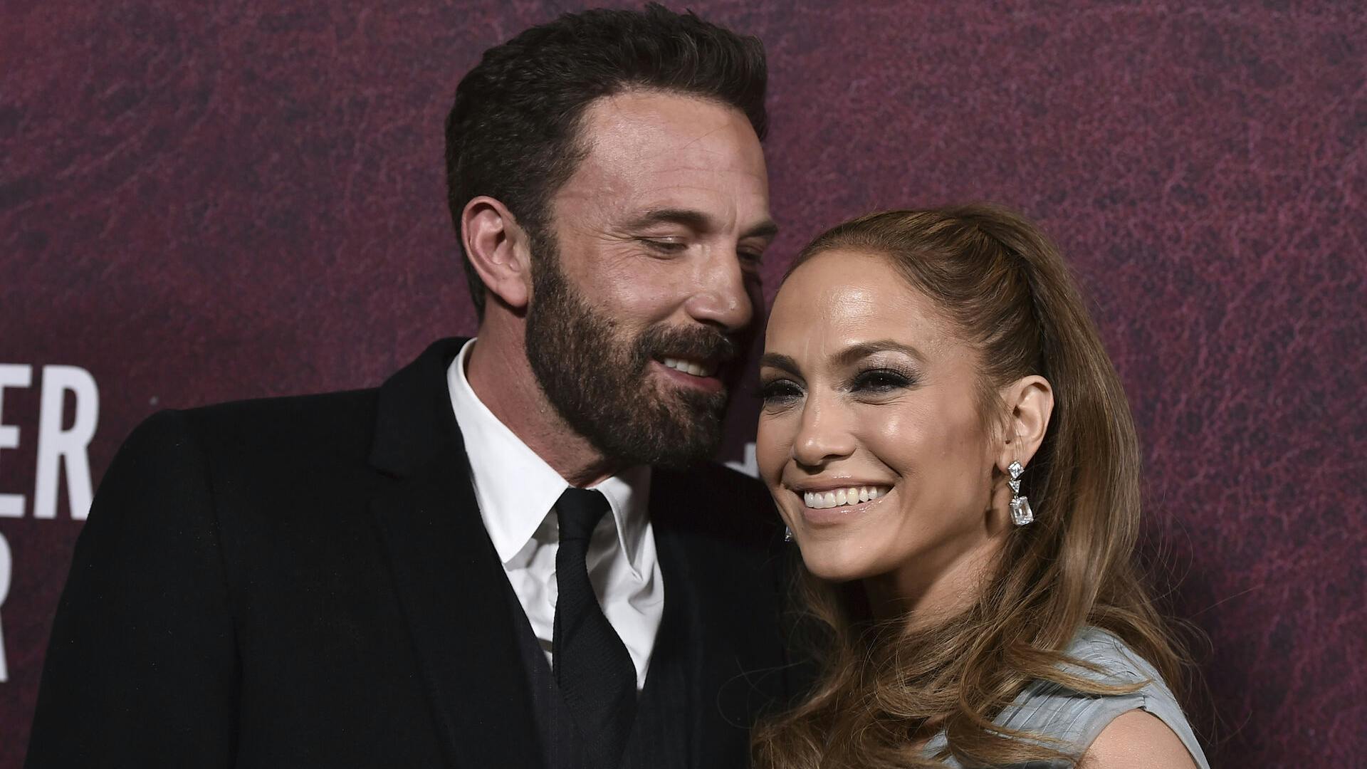 Ben Affleck, left, and Jennifer Lopez arrive at the premiere of "The Tender Bar" on Sunday, Dec. 12, 2021, at the TCL Chinese Theatre in Los Angeles. (Photo by Jordan Strauss/Invision/AP)