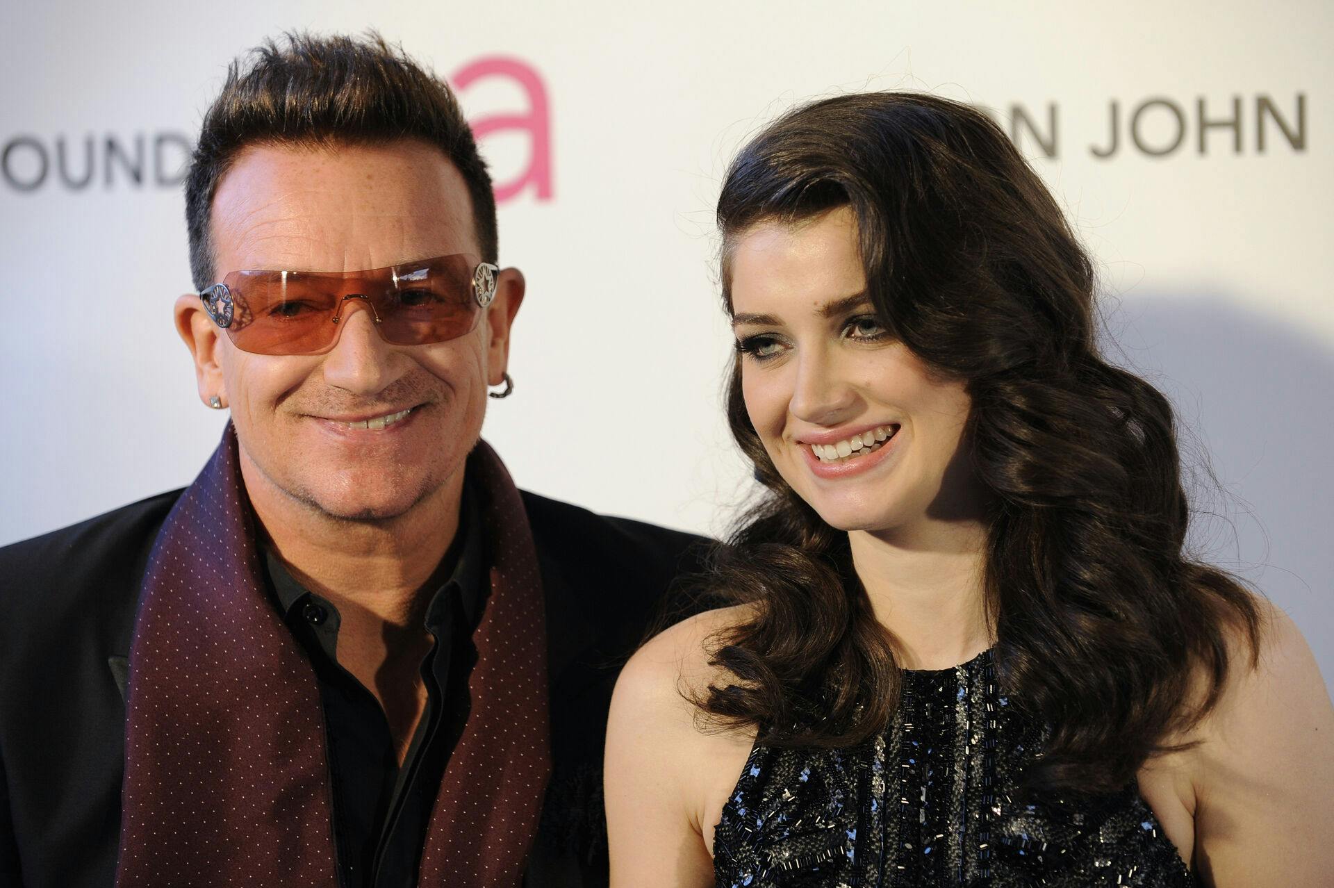 Musician Bono (L) and his daughter Eve Hewson arrive at the 2013 Elton John AIDS Foundation Oscar Party in West Hollywood, California, February 24, 2013. REUTERS/Gus Ruelas (UNITED STATES - Tags: ENTERTAINMENT) (OSCARS-PARTIES)