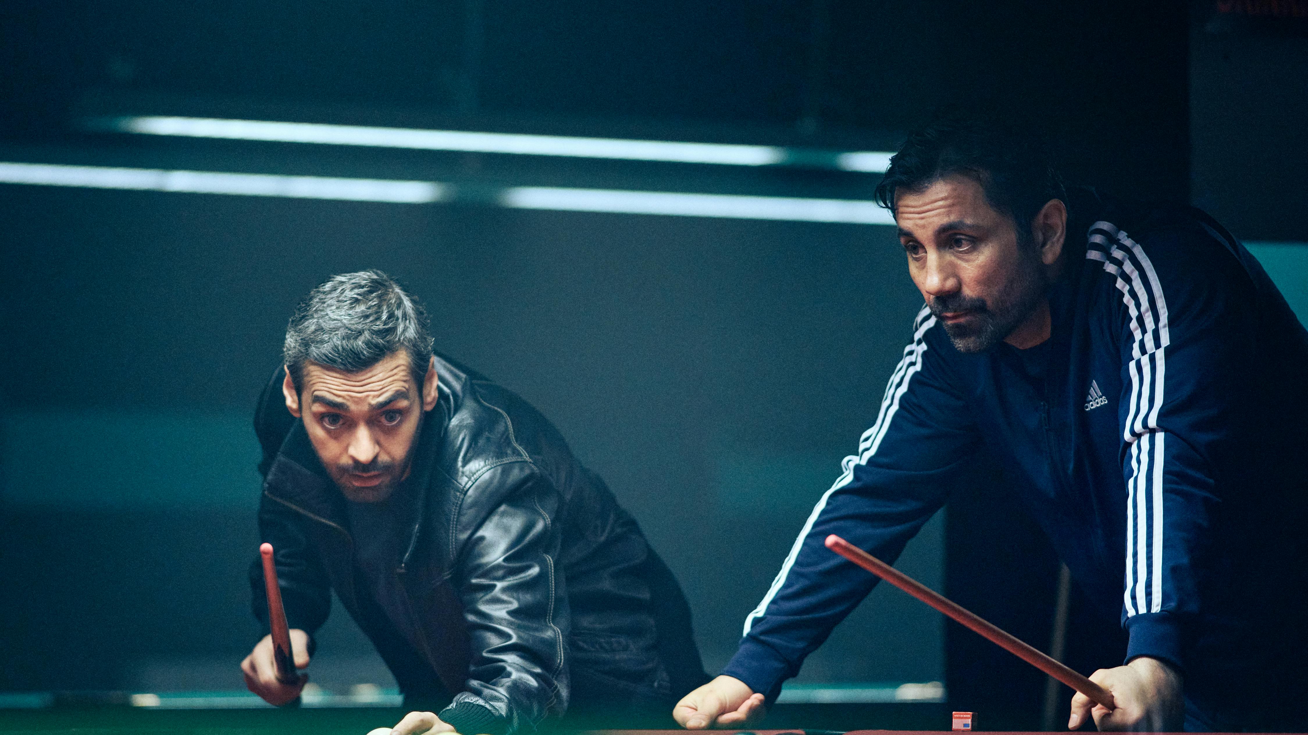 Helicopter Heist. (L to R) Ardalan Esmaili as Michel and Mahmut Suvakci as Rami in Helicopter Hesit. Courtesy of Netflix © 2023