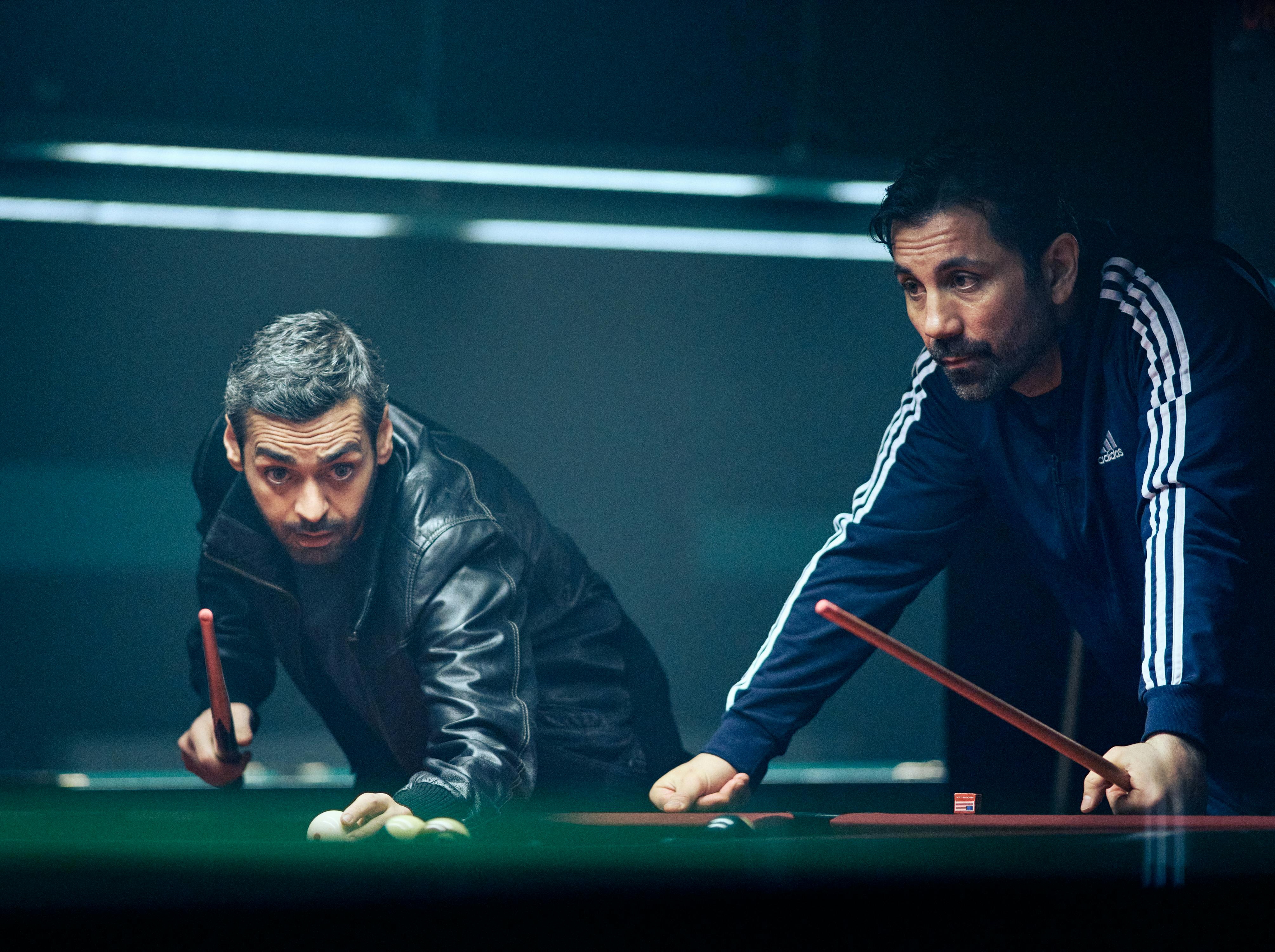 Helicopter Heist. (L to R) Ardalan Esmaili as Michel and Mahmut Suvakci as Rami in Helicopter Hesit. Courtesy of Netflix © 2023