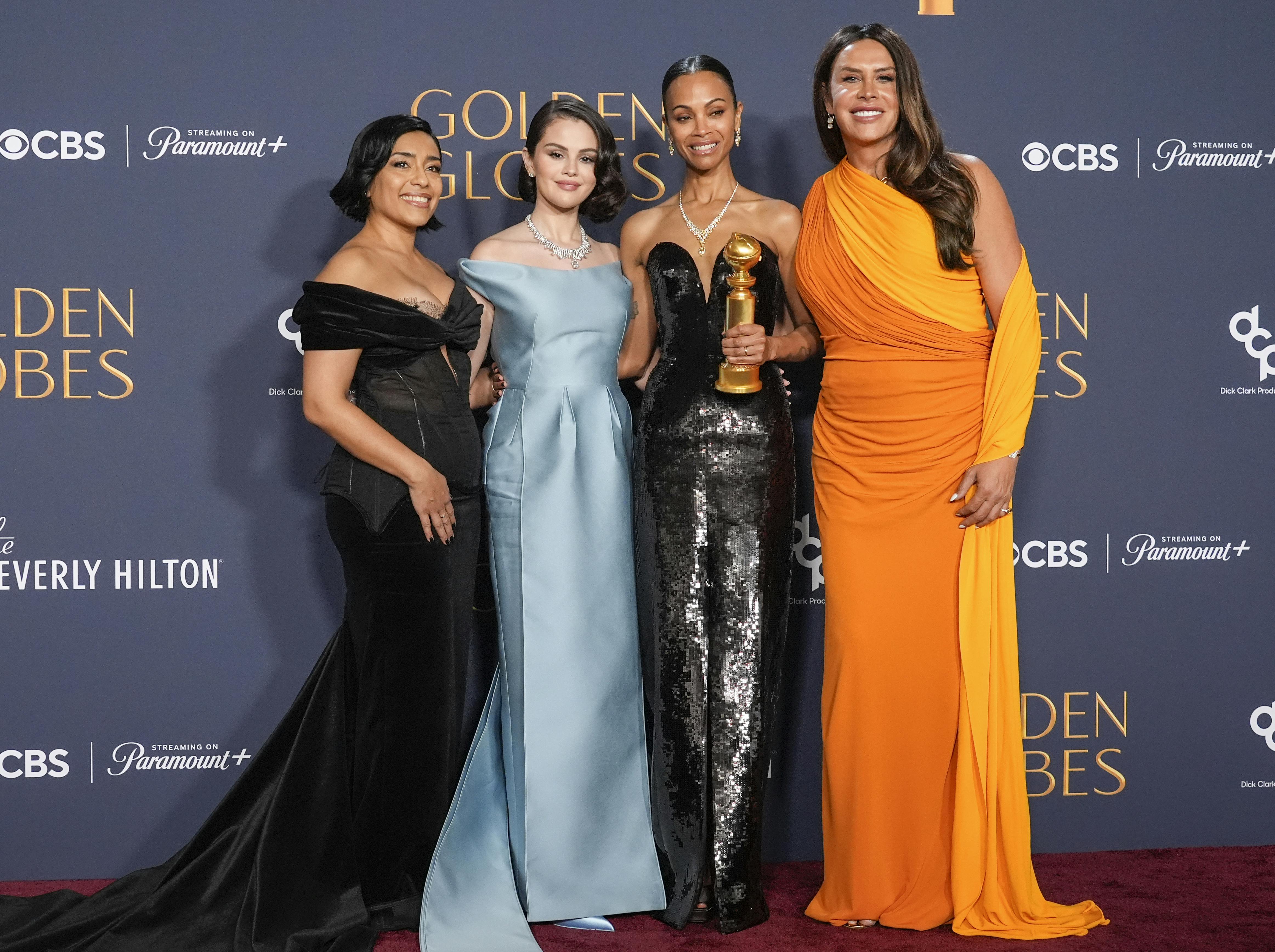 Adriana Paz, from left, Selena Gomez, Zoe Saldana, winner of the award for best performance by a female actor in a supporting role in any motion picture for "Emilia Perez, " and Karla Sofia Gascon pose in the press room during the 82nd Golden Globes on Sunday, Jan. 5, 2025, at the Beverly Hilton in Beverly Hills, Calif. (AP Photo/Chris Pizzello)