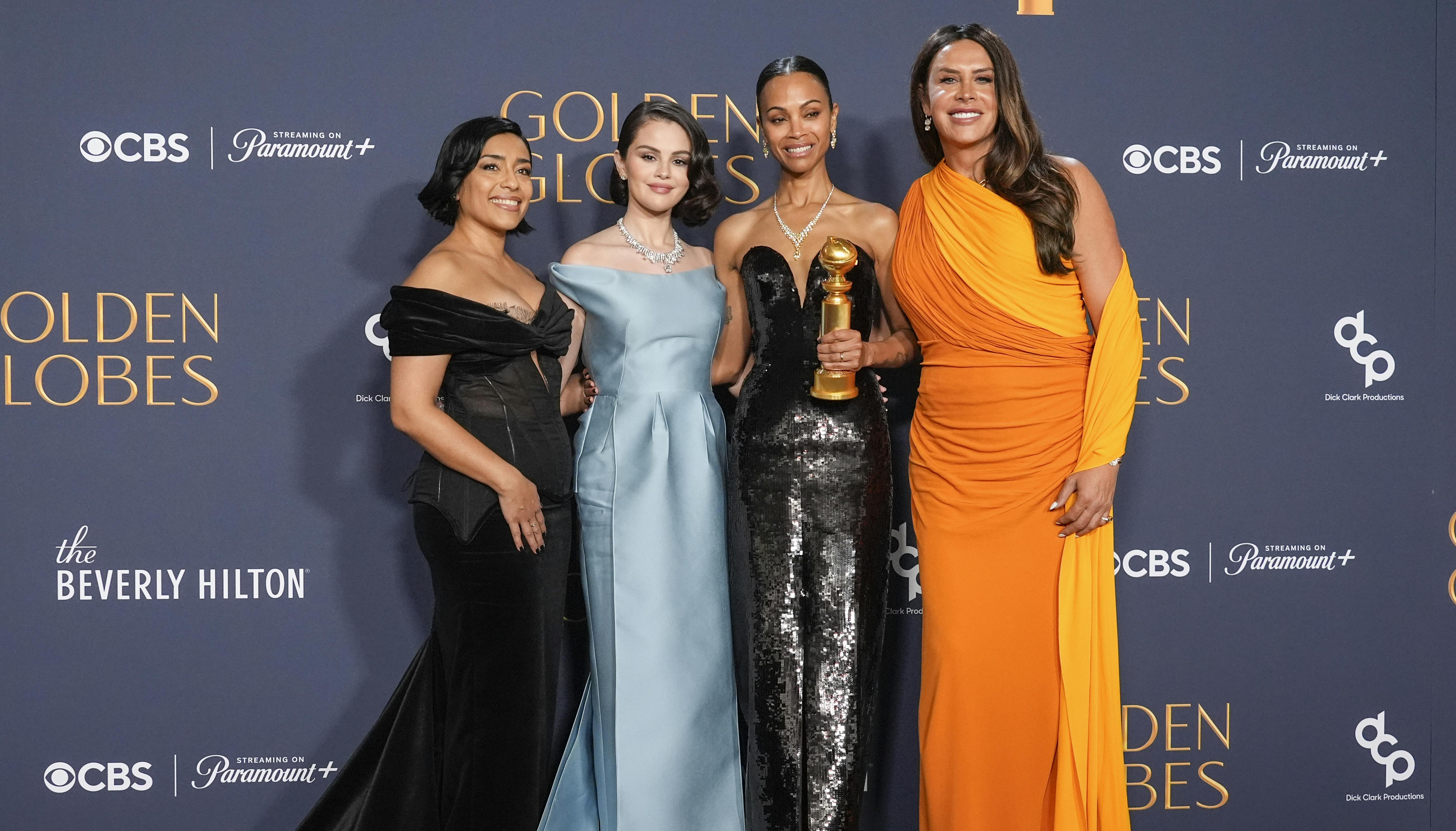 Adriana Paz, from left, Selena Gomez, Zoe Saldana, winner of the award for best performance by a female actor in a supporting role in any motion picture for "Emilia Perez, " and Karla Sofia Gascon pose in the press room during the 82nd Golden Globes on Sunday, Jan. 5, 2025, at the Beverly Hilton in Beverly Hills, Calif. (AP Photo/Chris Pizzello)