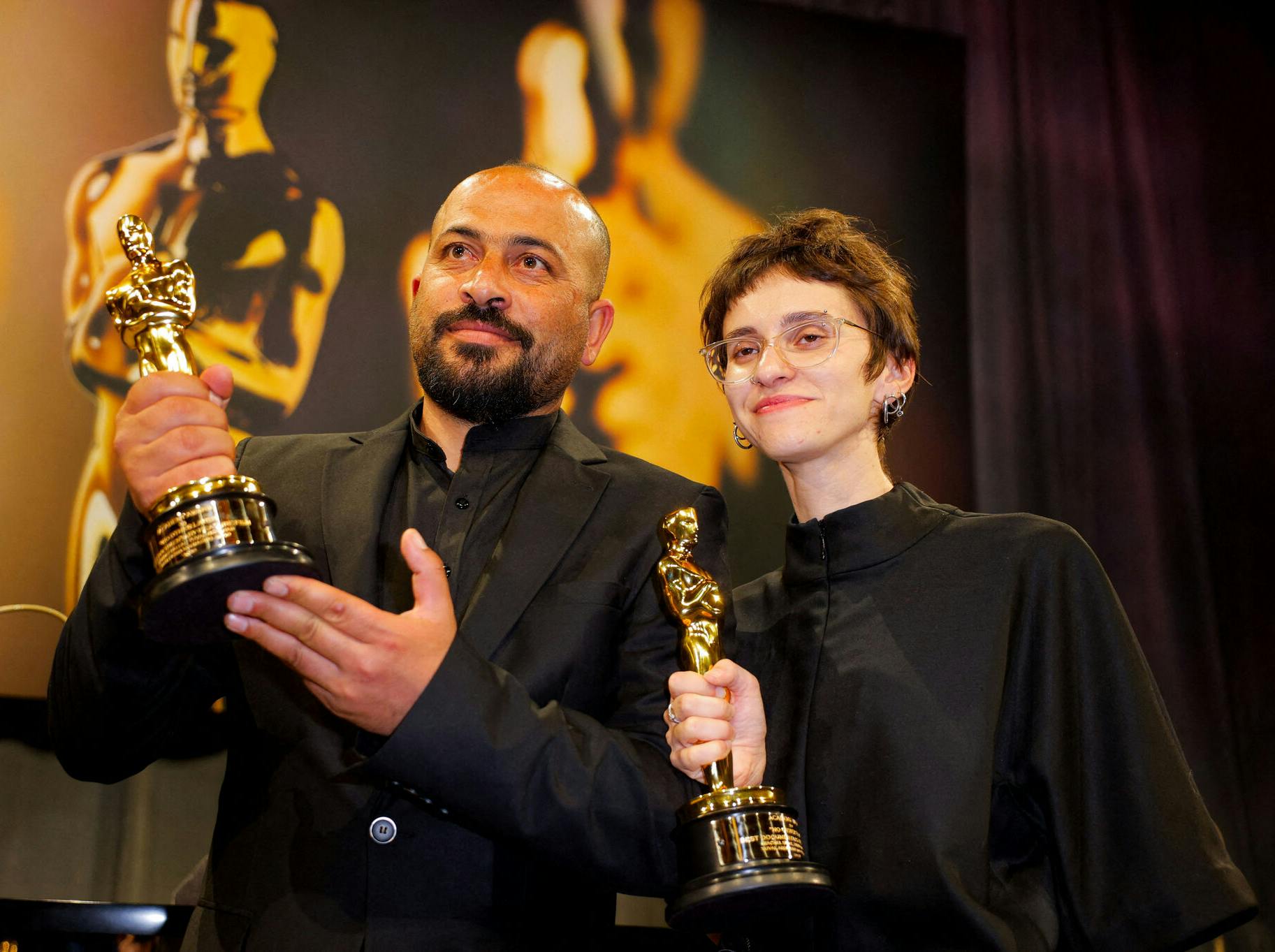 Rachel Szor and Hamdan Ballal pose with the Oscar for Best Documentary Feature Film for "No Other Land" at the Governors Ball following the Oscars show at the 97th Academy Awards in Hollywood, Los Angeles, California, U.S., March 2, 2025. REUTERS/Mike Blake/File Photo
