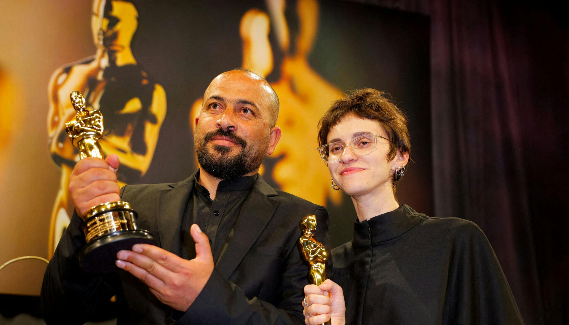 Rachel Szor and Hamdan Ballal pose with the Oscar for Best Documentary Feature Film for "No Other Land" at the Governors Ball following the Oscars show at the 97th Academy Awards in Hollywood, Los Angeles, California, U.S., March 2, 2025. REUTERS/Mike Blake/File Photo